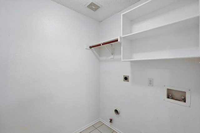 3516 San Patricio Dr, Plano, TX 75025 - laundry area with hookup for a washing machine, hookup for an electric dryer, hookup for a gas dryer, and light tile patterned floors