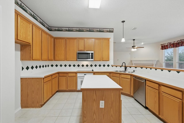 3516 San Patricio Dr, Plano, TX 75025 - kitchen with stainless steel appliances, ceiling fan, backsplash, and light countertops