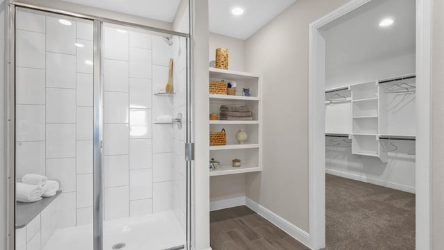 1270 Quartzite St, Cedar Hill, TX 75104 - bathroom with a walk in closet, a shower stall, recessed lighting, and wood finished floors