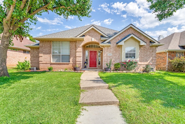 2009 Reddenson Dr, Carrollton, TX 75010 - single story home featuring brick siding, a front lawn, and roof with shingles
