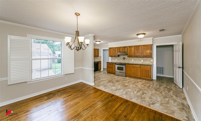 416 Albany Ave, Shreveport, LA 71105 - kitchen with electric stove, hardwood / wood-style floors, brown cabinetry, under cabinet range hood, and a chandelier