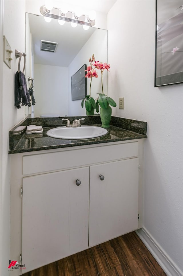 719 Edgemont St, Shreveport, LA 71106 - bathroom featuring vanity and wood finished floors