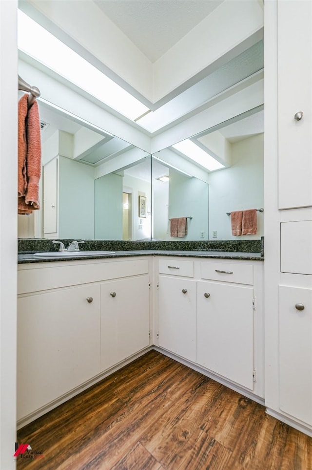 719 Edgemont St, Shreveport, LA 71106 - bathroom with vanity and wood finished floors