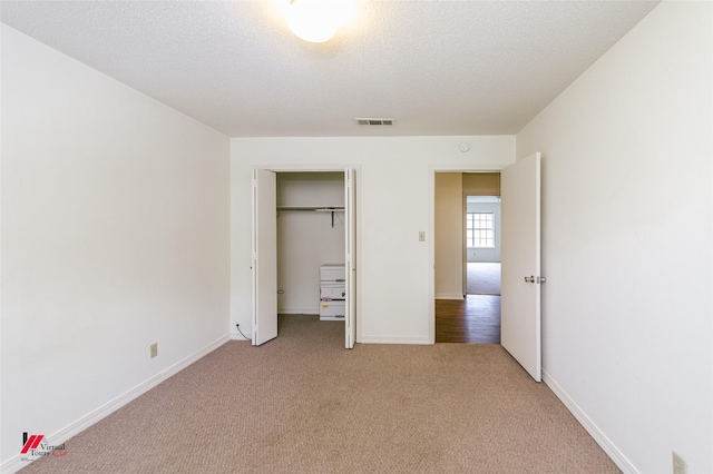 719 Edgemont St, Shreveport, LA 71106 - unfurnished bedroom featuring light carpet and a closet