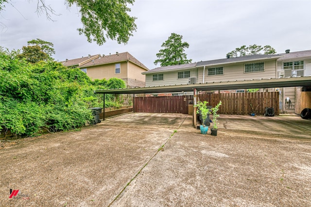 719 Edgemont St, Shreveport, LA 71106 - rear view of property featuring covered parking