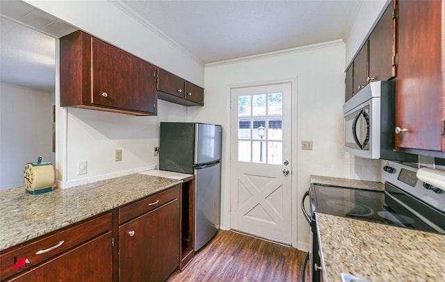 719 Edgemont St, Shreveport, LA 71106 - kitchen featuring appliances with stainless steel finishes, crown molding, dark wood-type flooring, tasteful backsplash, and reddish brown cabinets