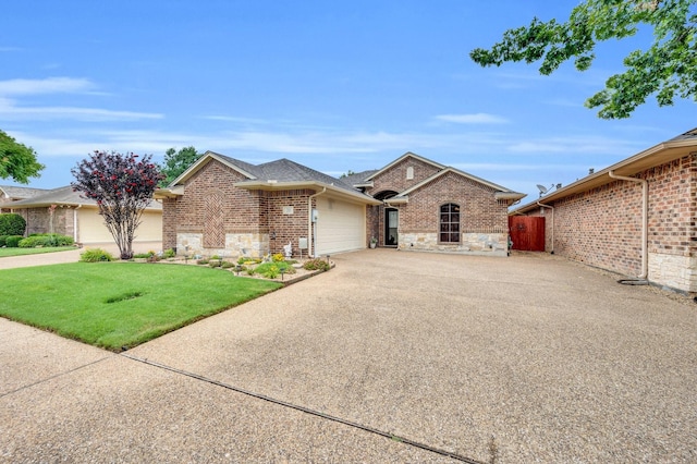 210 Oleander Pl, Waxahachie, TX 75165 - view of front facade featuring an attached garage, concrete driveway, stone siding, and brick siding