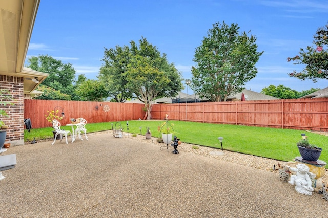 210 Oleander Pl, Waxahachie, TX 75165 - fenced backyard with a patio