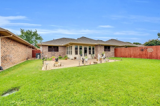 210 Oleander Pl, Waxahachie, TX 75165 - back of property featuring a fenced backyard, a patio area, and brick siding