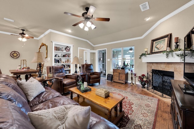 210 Oleander Pl, Waxahachie, TX 75165 - living room featuring ceiling fan, wood finished floors, a high end fireplace, and crown molding