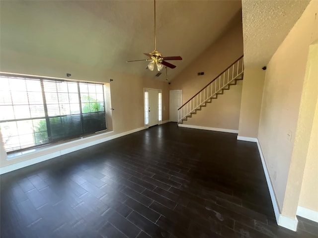 1705 Huntington Dr, Mesquite, TX 75149 - unfurnished living room featuring ceiling fan, stairway, lofted ceiling, and wood finished floors