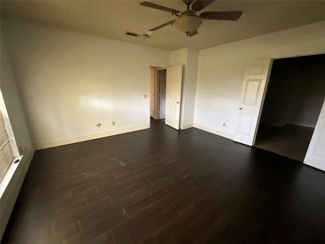 1705 Huntington Dr, Mesquite, TX 75149 - unfurnished bedroom with dark wood finished floors and ceiling fan