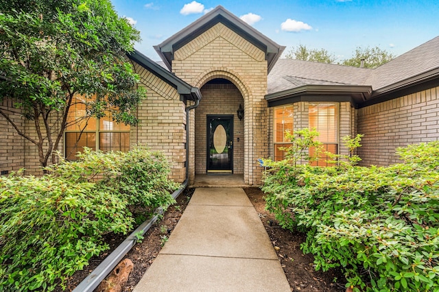 817 Tall Oak Ln, Keller, TX 76248 - view of exterior entry featuring brick siding and roof with shingles