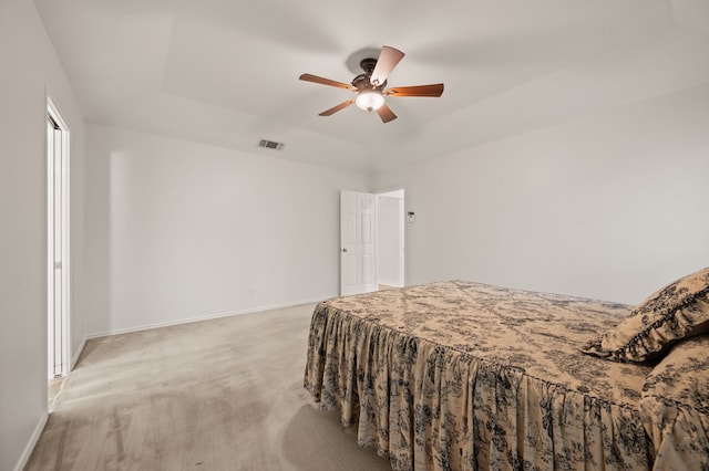 817 Tall Oak Ln, Keller, TX 76248 - bedroom with light colored carpet, a tray ceiling, and a ceiling fan