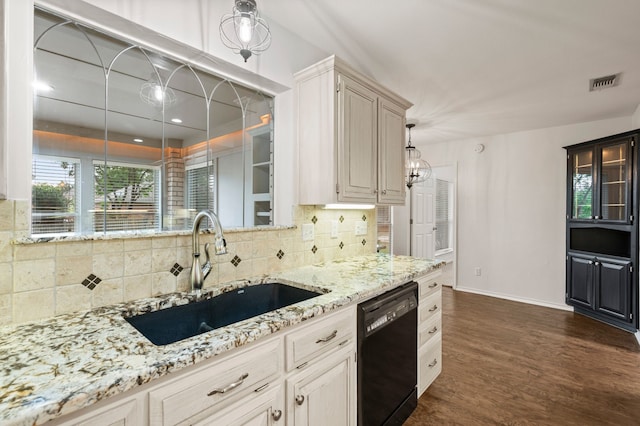 817 Tall Oak Ln, Keller, TX 76248 - kitchen featuring black dishwasher, light stone countertops, tasteful backsplash, and dark wood-style floors