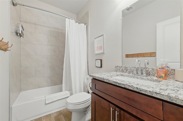 2409 Ross Ave, Fort Worth, TX 76164 - full bath with vanity, shower / tub combo, and wood finished floors