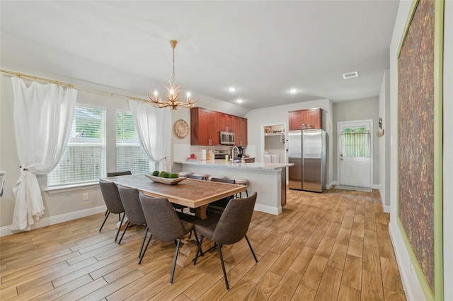 2409 Ross Ave, Fort Worth, TX 76164 - dining area featuring light wood finished floors, a chandelier, and recessed lighting