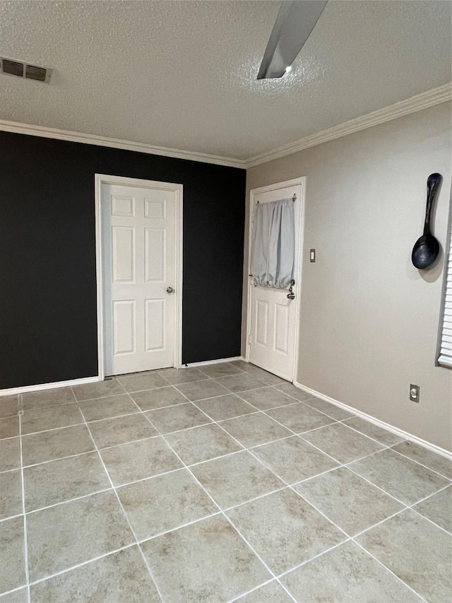 8732 Fox Meadow Way, Fort Worth, TX 76123 - tiled entrance foyer with a textured ceiling and ornamental molding