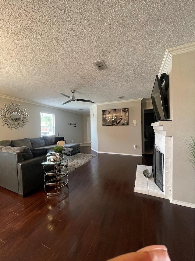 8732 Fox Meadow Way, Fort Worth, TX 76123 - living room featuring crown molding, a glass covered fireplace, wood finished floors, ceiling fan, and a textured ceiling