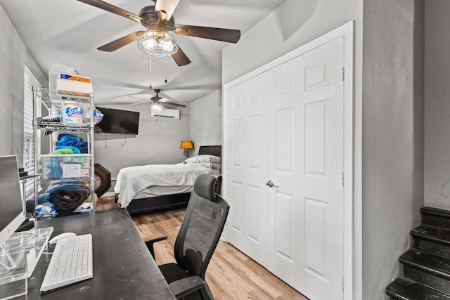 84 Kristin Dr, Pottsboro, TX 75076 - bedroom featuring wood finished floors, an office area, a ceiling fan, and a wall unit AC