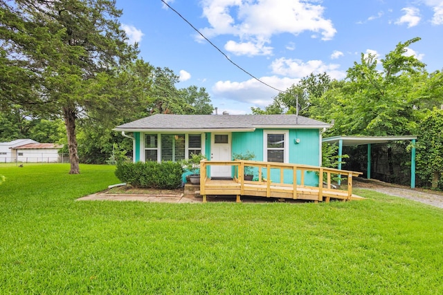 84 Kristin Dr, Pottsboro, TX 75076 - view of front of property with a front lawn, driveway, a deck, and a detached carport