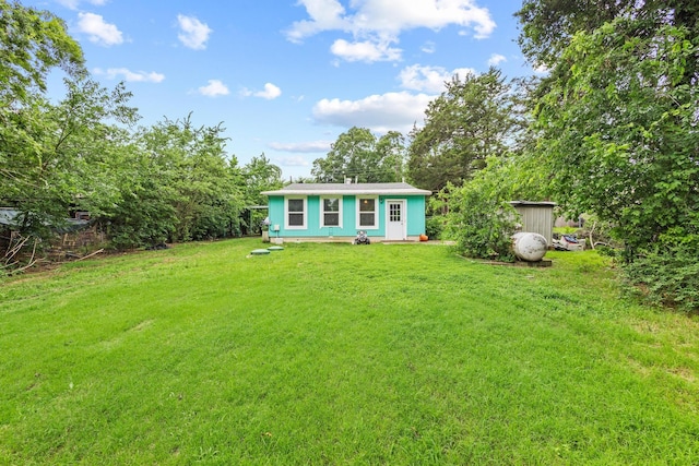84 Kristin Dr, Pottsboro, TX 75076 - view of green lawn with an outbuilding
