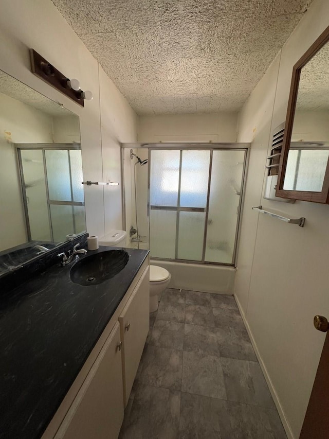 3560 Regal Rd, Fort Worth, TX 76111 - full bathroom featuring vanity, shower / bath combination with glass door, and a textured ceiling