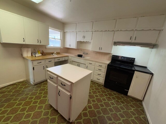 3560 Regal Rd, Fort Worth, TX 76111 - kitchen with electric range, under cabinet range hood, and white cabinets
