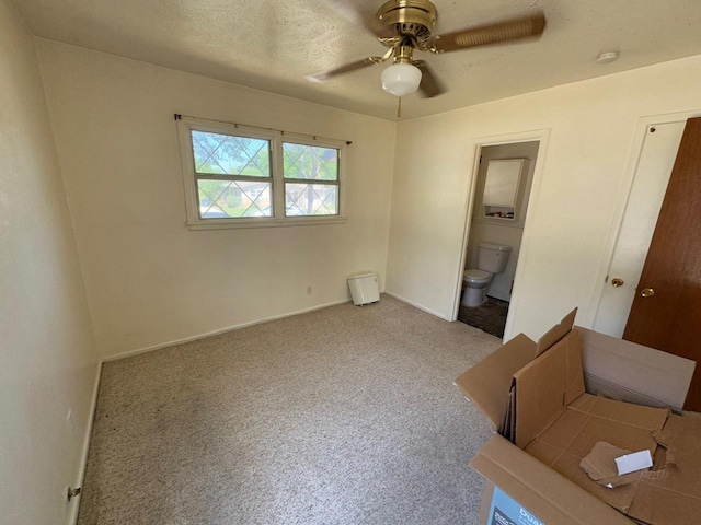 3560 Regal Rd, Fort Worth, TX 76111 - unfurnished bedroom featuring carpet, connected bathroom, and a ceiling fan