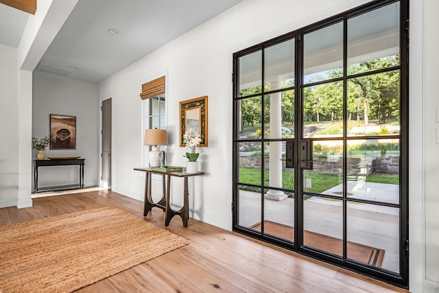 3560 Pleasant Run Cir, Athens, TX 75752 - entryway featuring plenty of natural light, wood finished floors, and french doors