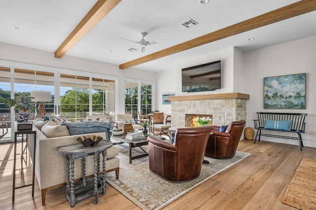 3560 Pleasant Run Cir, Athens, TX 75752 - living area featuring beamed ceiling, ceiling fan, wood finished floors, a fireplace, and recessed lighting