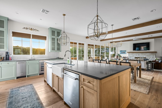 3560 Pleasant Run Cir, Athens, TX 75752 - kitchen featuring stainless steel dishwasher, beverage cooler, decorative backsplash, light wood finished floors, and recessed lighting