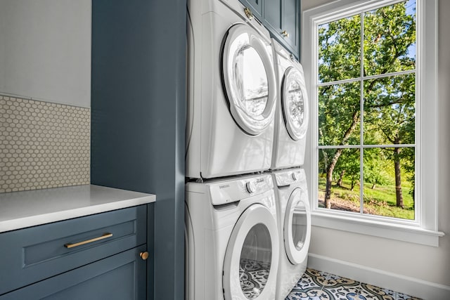 3560 Pleasant Run Cir, Athens, TX 75752 - laundry room with cabinet space, estacked washer and dryer, and healthy amount of natural light