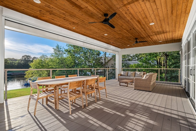 3560 Pleasant Run Cir, Athens, TX 75752 - wooden deck with an outdoor living space, outdoor dining area, ceiling fan, and a water view