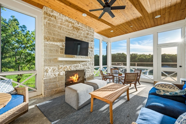 3560 Pleasant Run Cir, Athens, TX 75752 - sunroom / solarium with ceiling fan and an outdoor living space with a fireplace