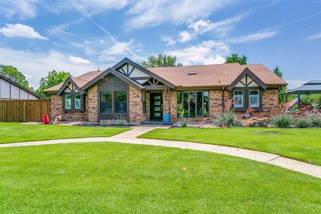 121 E Louella Dr, Hurst, TX 76054 - tudor home featuring brick siding, a shingled roof, and a gazebo