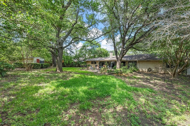 5512 Lake Charles Dr, Waco, TX 76710 - view of yard featuring a storage unit