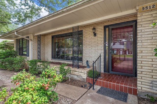 5512 Lake Charles Dr, Waco, TX 76710 - view of exterior entry featuring brick siding and a porch