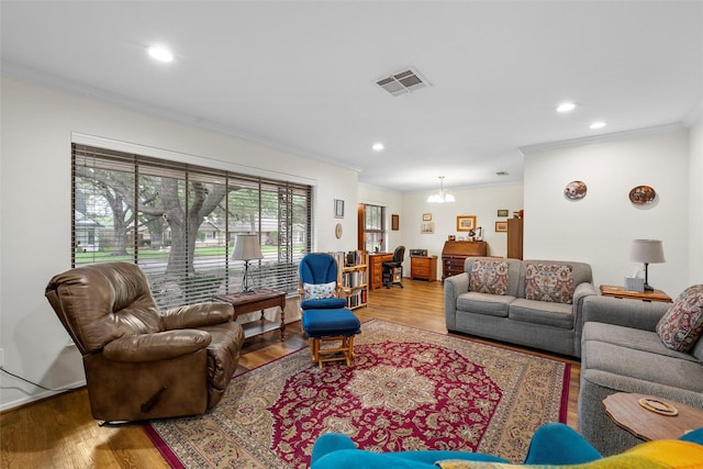 5512 Lake Charles Dr, Waco, TX 76710 - living area featuring wood finished floors, crown molding, a chandelier, and recessed lighting