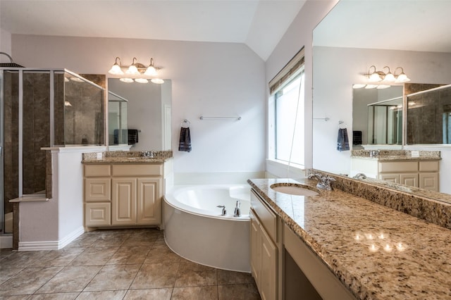7601 Willowbend Dr, Mckinney, TX 75071 - full bath featuring a stall shower, two vanities, a bath, and vaulted ceiling