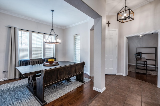 7601 Willowbend Dr, Mckinney, TX 75071 - dining space featuring a chandelier, crown molding, and dark wood-type flooring