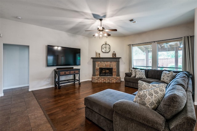 7601 Willowbend Dr, Mckinney, TX 75071 - living room featuring a ceiling fan, wood finished floors, and a fireplace