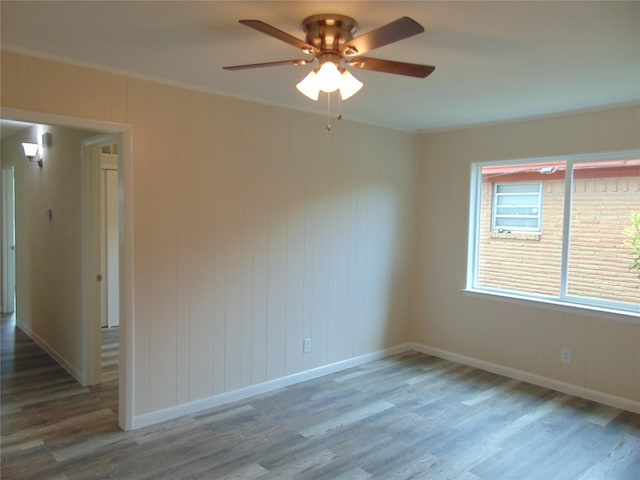 802 Acton Ave, Duncanville, TX 75137 - unfurnished room with wood finished floors, ceiling fan, and crown molding