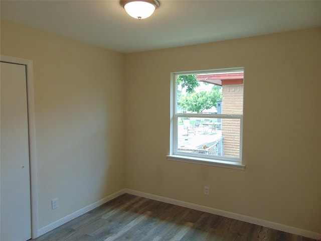 802 Acton Ave, Duncanville, TX 75137 - empty room with dark wood-style flooring and baseboards