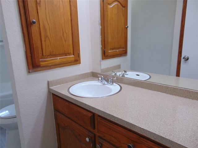 802 Acton Ave, Duncanville, TX 75137 - bathroom featuring vanity and toilet