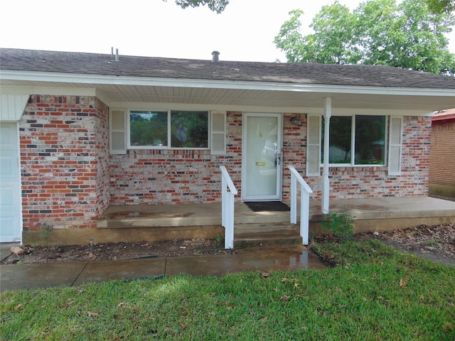 802 Acton Ave, Duncanville, TX 75137 - ranch-style home with covered porch, brick siding, and roof with shingles