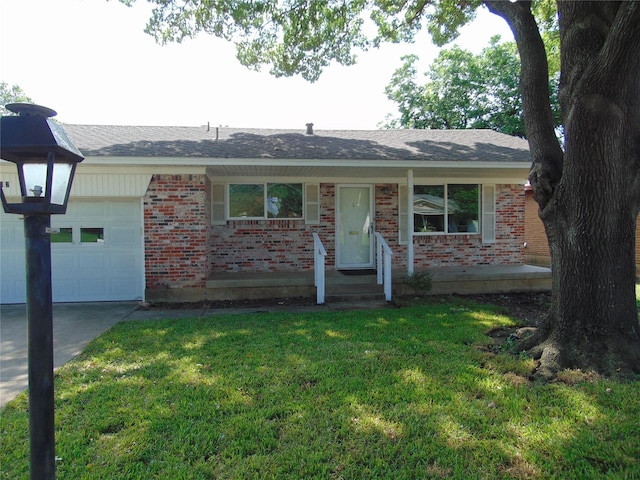 802 Acton Ave, Duncanville, TX 75137 - single story home with a garage, brick siding, a front lawn, driveway, and a shingled roof