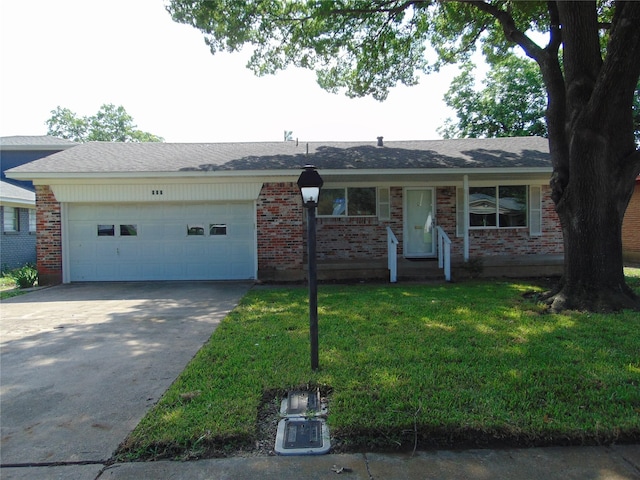 802 Acton Ave, Duncanville, TX 75137 - single story home featuring an attached garage, driveway, brick siding, and a front yard