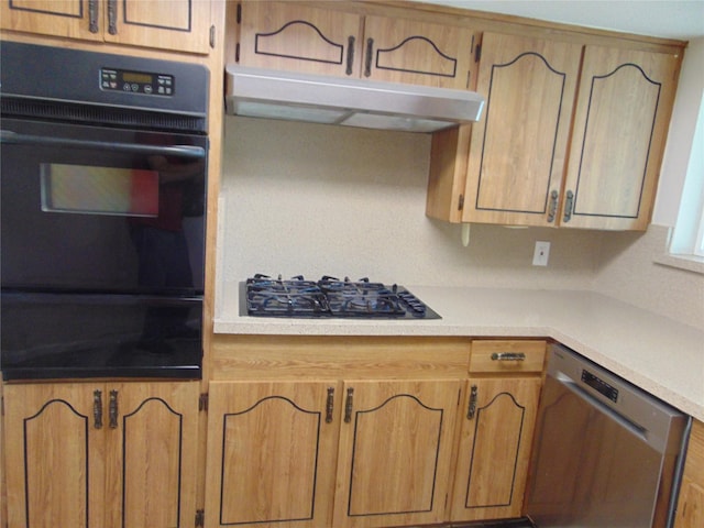 802 Acton Ave, Duncanville, TX 75137 - kitchen with stainless steel dishwasher, gas stovetop, black oven, a warming drawer, and under cabinet range hood