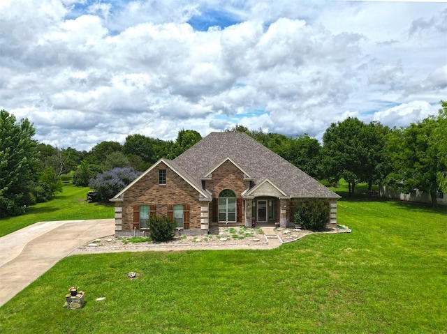 104 Coldwater Creek Ln, Weatherford, TX 76088 - view of front of house featuring a front yard, brick siding, and roof with shingles